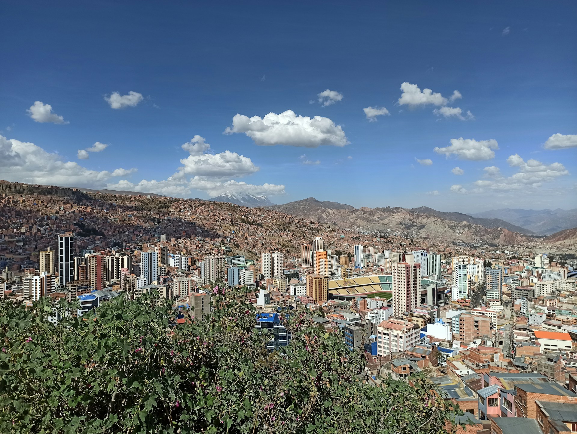 Panoramic view of La Paz, Bolivia with residential towers and mountains in the background